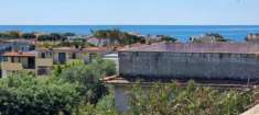 Foto Appartamento con terrazzo vista mare e giardino