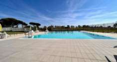 Foto Appartamento in Vendita a Aranova - Via Nino Manfredi, Con Piscina Condominiale