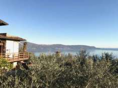 Foto Lago di Garda: Il Tuo Trilocale Panoramico con Taverna, Rifugio di Quiete