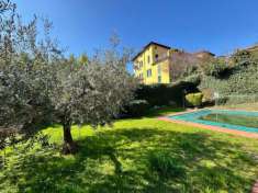 Foto Trilocale al Piano Terra con Portico Abitabile e Piscina Condominiale