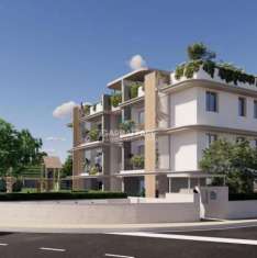 Foto Trilocale con ampio giardino privato e piscina .