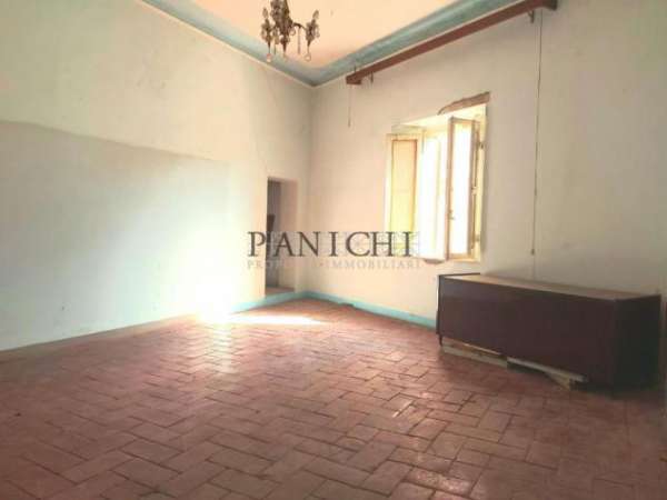 Foto Appartamento in palazzo con terrazza a tetto